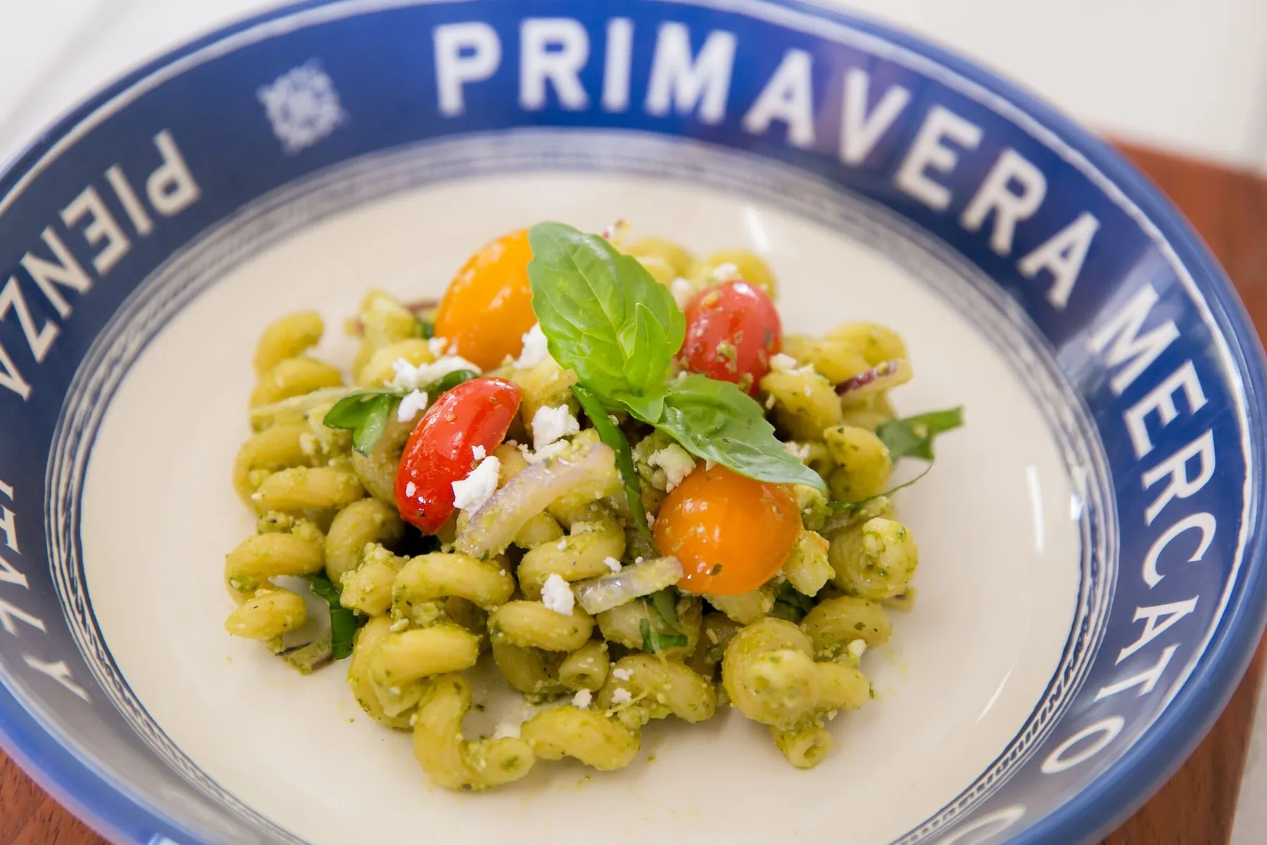 Pasta salad with fresh basil, cherry tomatoes and feta